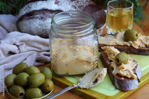 Brunost cheese with black bread and olives photo