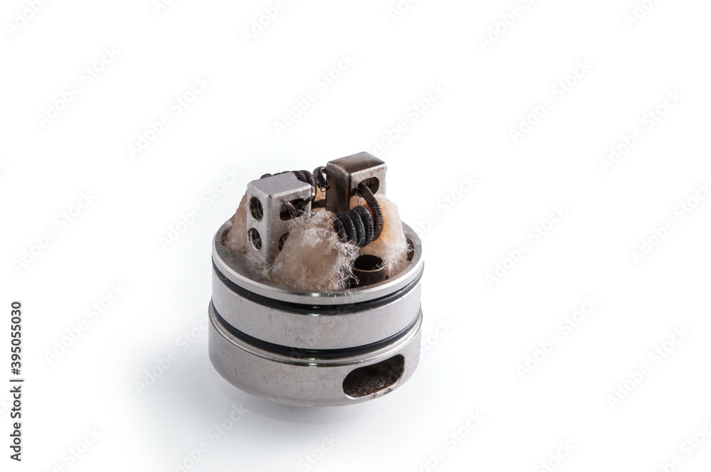 Isolated drip atomizer with dirty used coils and
wet cotton. RDA Isolated drip atomizer with dirty used coils and
wet cotton. RDA