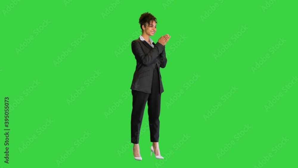 African business woman clapping her hands on a Green Screen, Chroma Key. African business woman clapping her hands on a Green Screen, Chroma Key.