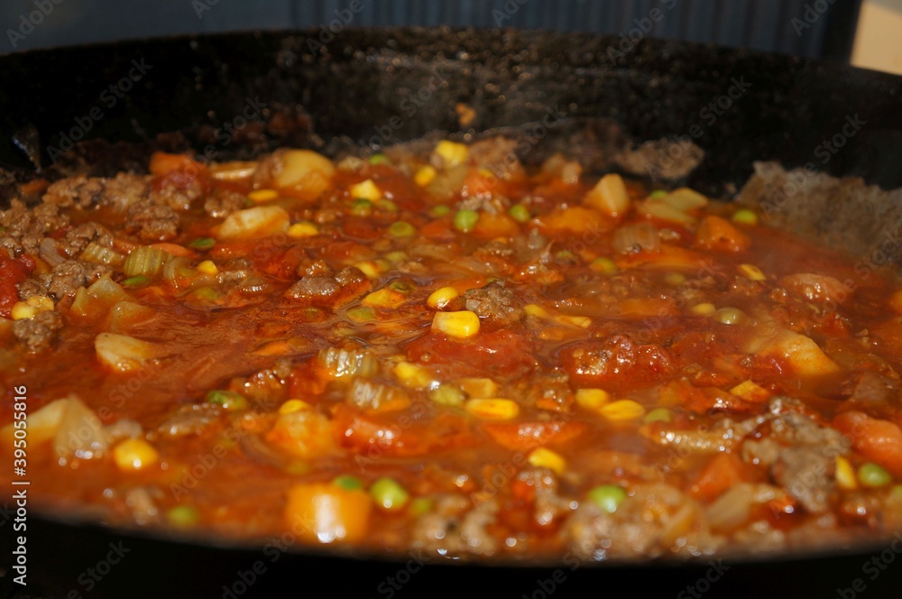 frying pan or wok with meat and vegetables frying pan or wok with meat and vegetables