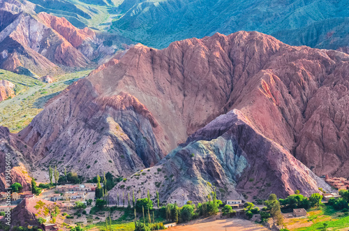 Stock photo of houses from the village of Purmamarca in Jujuy, Argentina. Landscape with colored mountains and hills