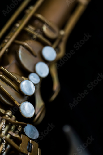 Vintage saxophone on a black background