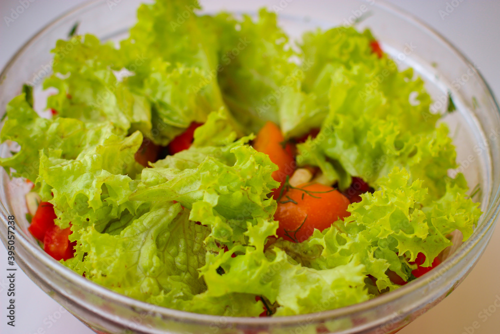 Delicious fresh vegetable salad in a glass plate Delicious fresh vegetable salad in a glass plate