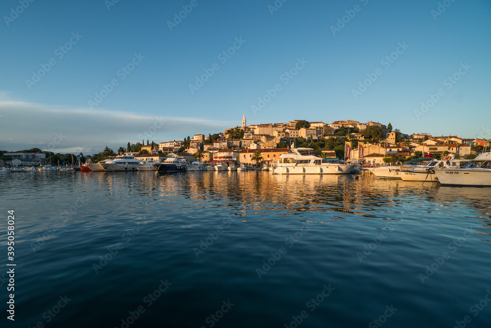 Sunset view of Vrsar in Croatia close to the Adriatic Sea. Viewpoint seen from a boat