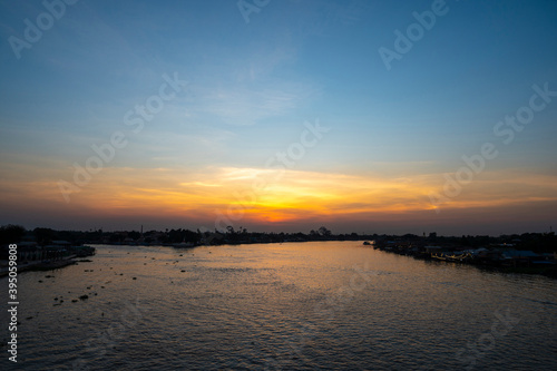 Beautiful Sunset View of Koh Kred at Rama IV bridge cross the Chao Phraya River in Park Kred, Nonthaburi province, Thailand © serra715