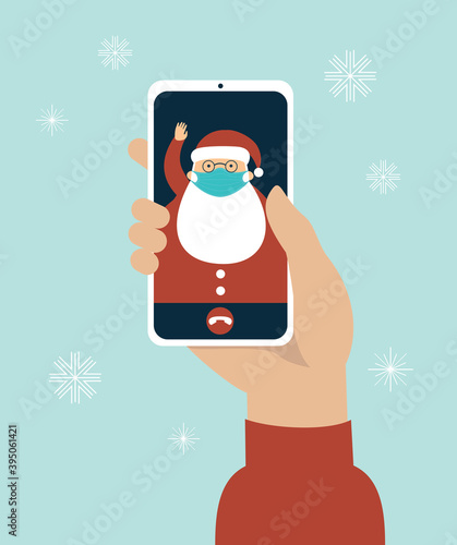 video call on the screen with Santa Claus wearing a protective medical mask. COVID-19 2019-ncov disease pandemic. Safety measures.