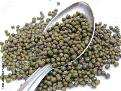 mung beans in a spoon with white background