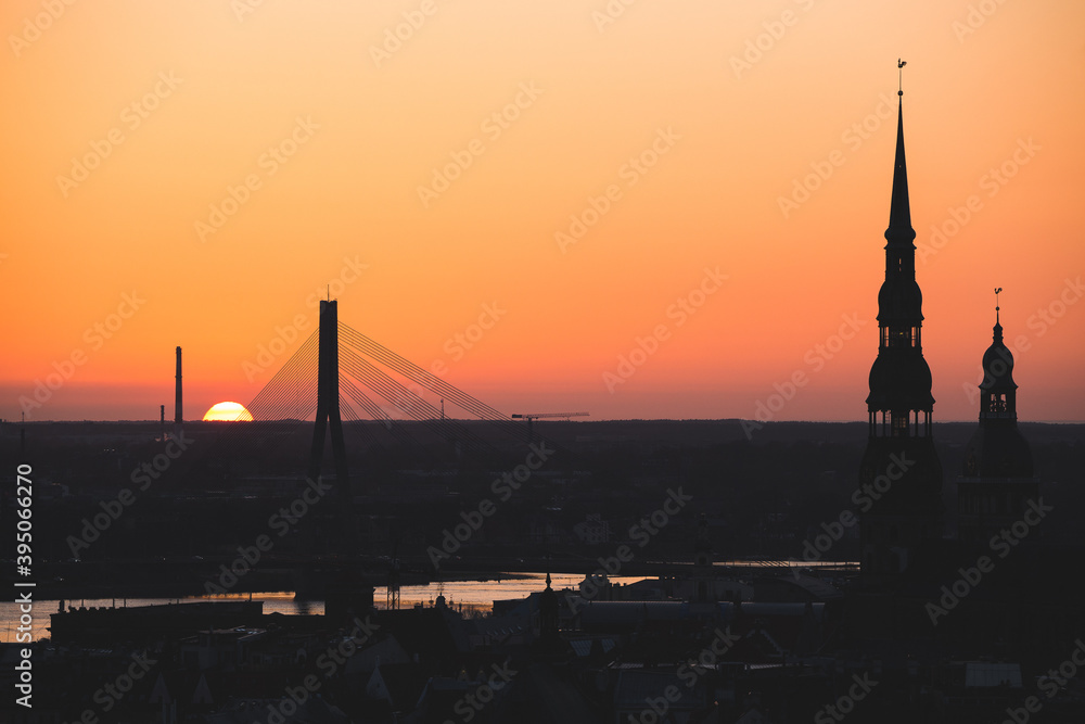 Fototapeta premium sunset over the capital of Latvia, Riga, top of the churches violet sky