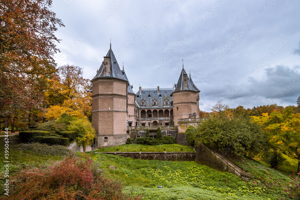 Fototapeta premium Autumn trees alley with colorful leaves in the park