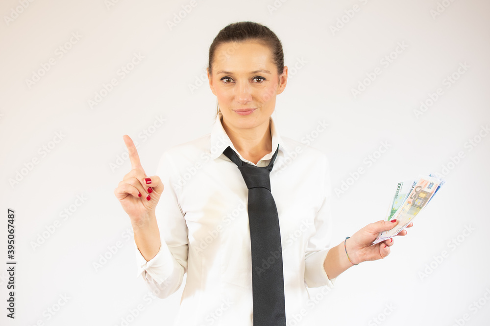 Smiling business woman pointing up and looking at the camera over white background Smiling business woman pointing up and looking at the camera over white background