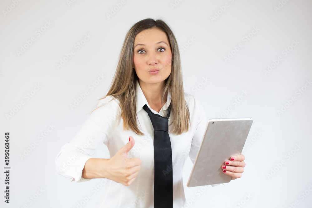 Portrait of surprised business woman holding tablet on white background Portrait of surprised business woman holding tablet on white background