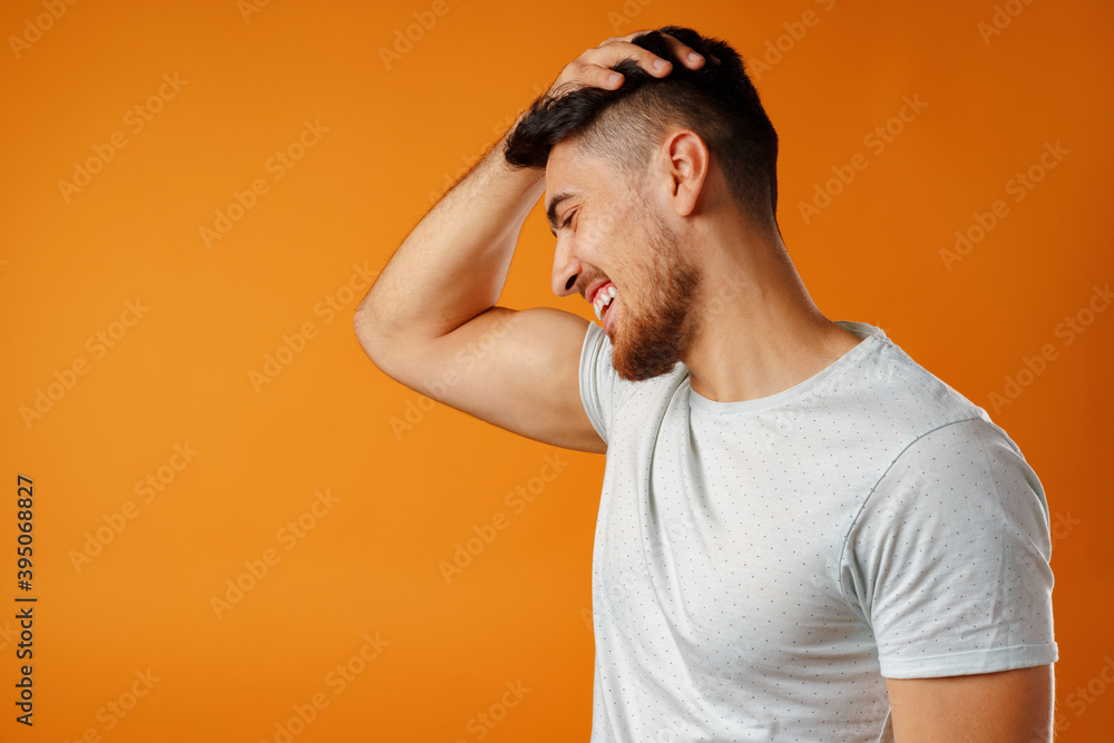 Young positive european man standing in blank white shirt laughing Young positive european man standing in blank white shirt laughing