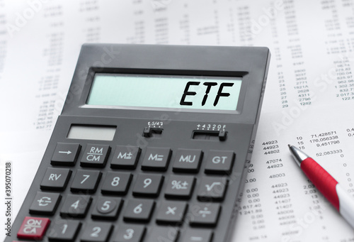 A calculator with the inscription ETF . Business profit concept