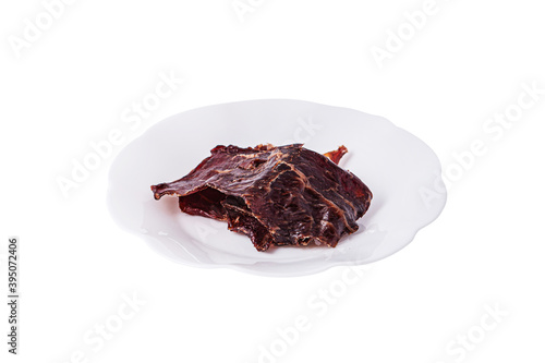 Beef chips in a plate on a white background