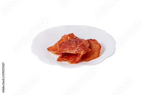 Pork chips in a plate on a white background