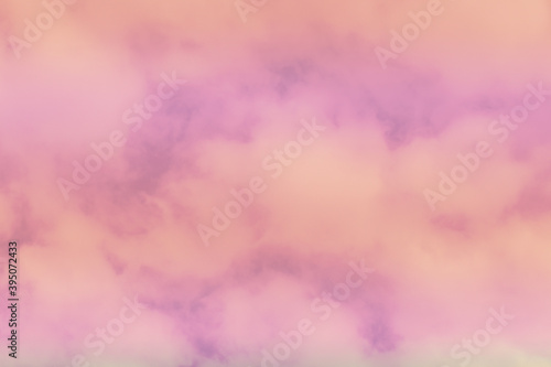 Beautiful sky and clouds in soft pastel color.Soft pink cloud in the sky background colorful pastel tone.