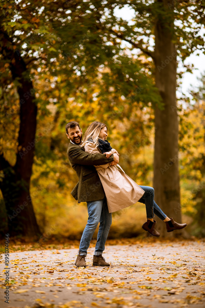 Young couple having fun in the autumn park Young couple having fun in the autumn park