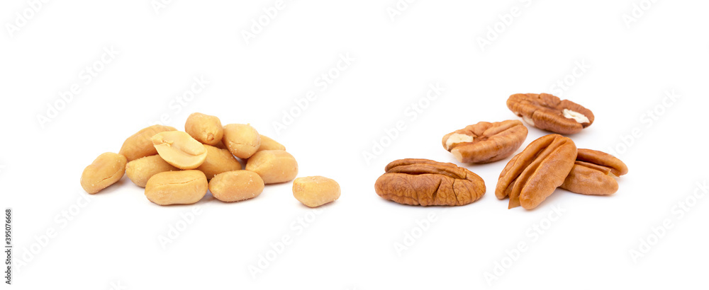 Fresh pecan nuts and peanuts isolated on a white background Fresh pecan nuts and peanuts isolated on a white background