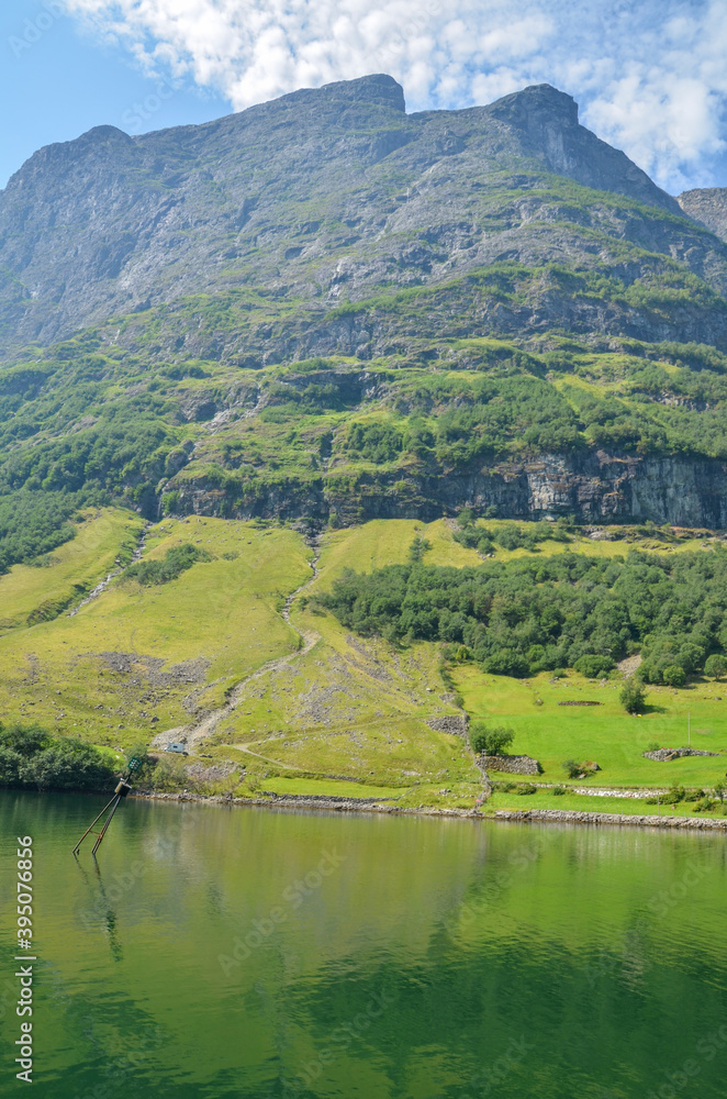 Beautiful fjord Sognefjord with rocky shores and turquoise water. Cruise around scandinavian beauty. Norway