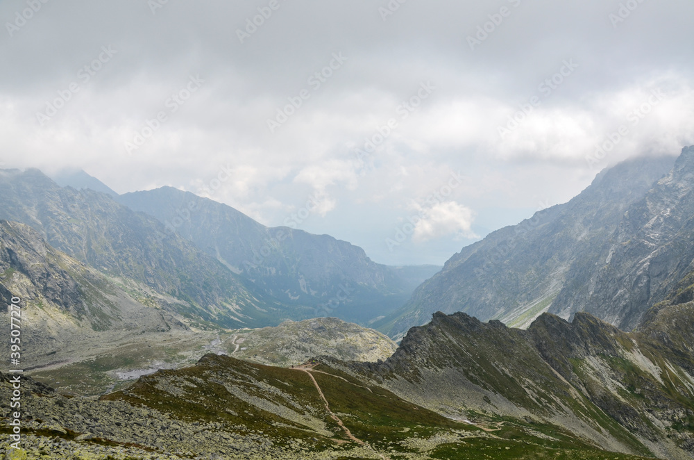 Mountain peaks, low clouds and fog. High Tatras Mountains in Slovakia Mountain peaks, low clouds and fog. High Tatras Mountains in Slovakia