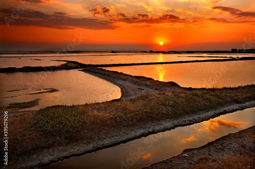 THESSALONIKI PREFECTURE, MACEDONIA, GREECE. Sunset photo at the lagoon of Angelochori, a wetland about 30 km from the city of Thessaloniki. photo