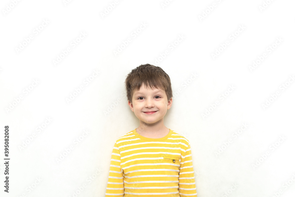 Happy Cute toddler boy caucasian in striped shirt with funny expression. Happy Cute toddler boy caucasian in striped shirt with funny expression.