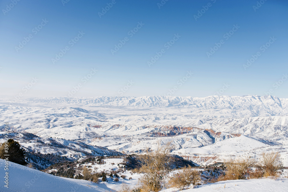 Panoramic view of the mountains with rocks in the Tien Shan mountains in Central Asia near Tashkent on a Sunny winter day. The best place for active life, Hiking and trekking in Uzbekistan