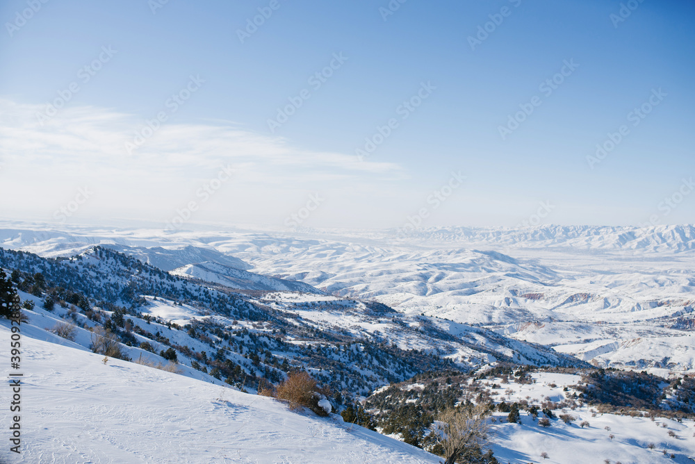 The incredible beauty of the winter landscape of the Tien Shan mountains in Uzbekistan on a clear day
