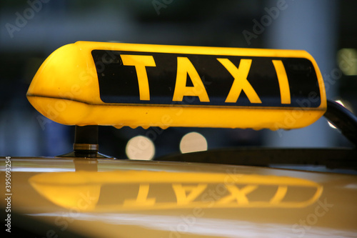 Taxi sign on cab, close-up view
