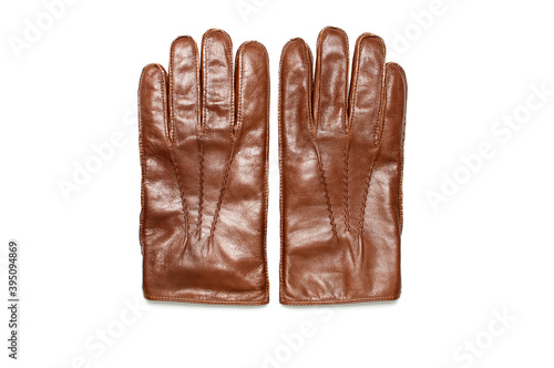 Brown classic leather men's gloves on white isolated background top view. Stylish Fashionable winter autumn spring clothing accessory. Genuine leather gloves. Stylish wardrobe item