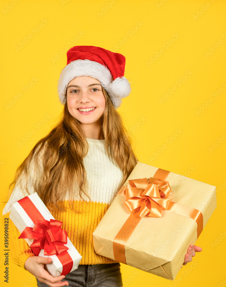 Kid little cheerful girl hold gift box. Satisfied with purchase. Shopping day. Child picking gifts for family. Small cute girl preparing holiday gifts. Receiving presents. Christmas gifts for kids Kid little cheerful girl hold gift box. Satisfied with purchase. Shopping day. Child picking gifts for family. Small cute girl preparing holiday gifts. Receiving presents. Christmas gifts for kids
