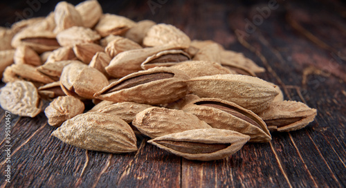 Almond kernels lie on a dark background.Selective focus.Salted almonds.