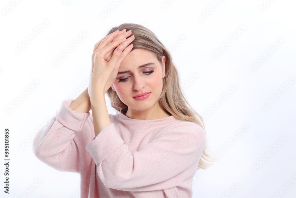 Young caucasian woman suffers from headache Young caucasian woman suffers from headache