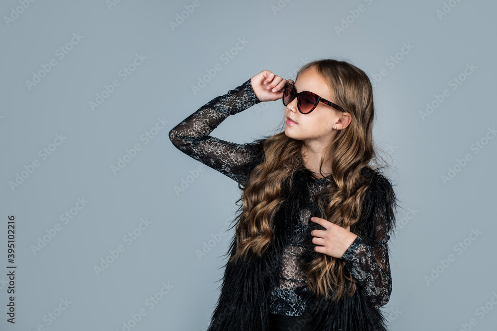female accessory. happy teen girl in sunglasses. spring kid fashion style. child with curly hair wearing trendy clothes. concept of beauty. childhood happiness. beauty and fashion. copy space female accessory. happy teen girl in sunglasses. spring kid fashion style. child with curly hair wearing trendy clothes. concept of beauty. childhood happiness. beauty and fashion. copy space