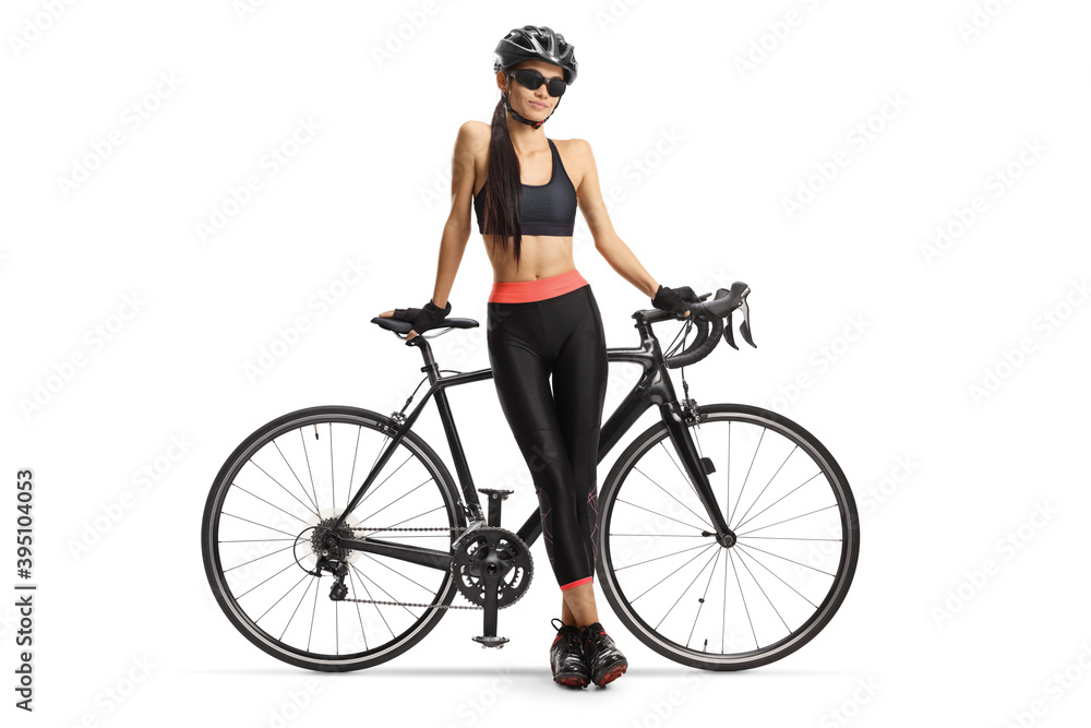Female cyclist posing with her road bicycle Female cyclist posing with her road bicycle