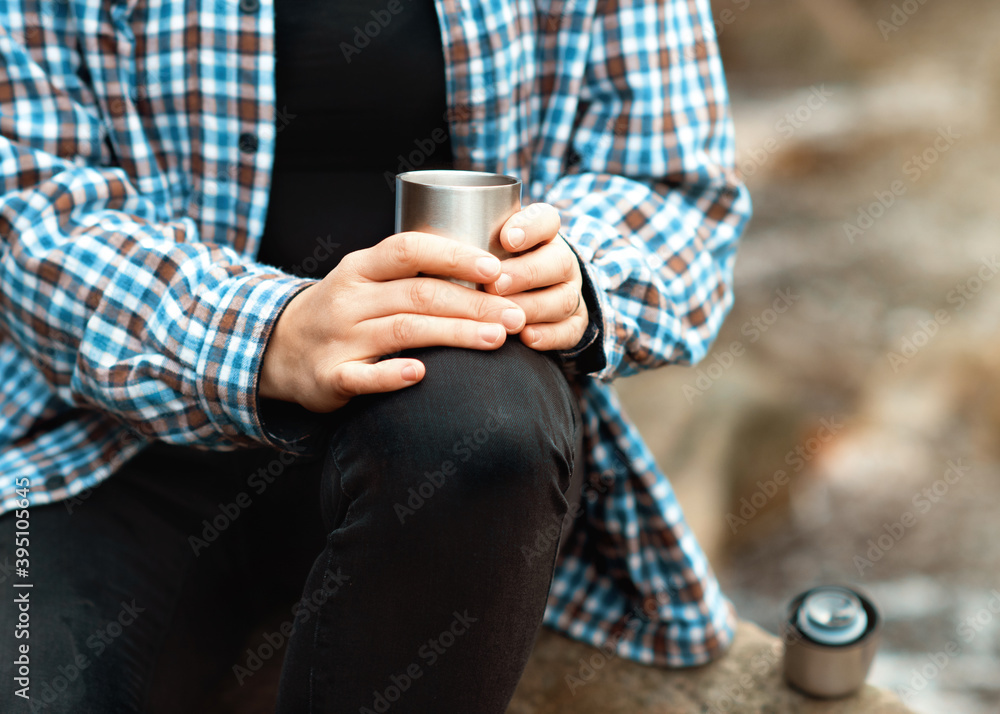 woman drinking coffee in the forest woman drinking coffee in the forest