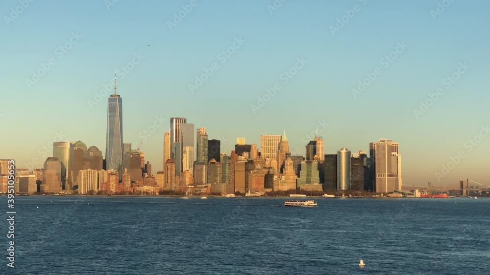 Downtown Manhattan skyline at sunset view from Ellis Island Downtown Manhattan skyline at sunset view from Ellis Island