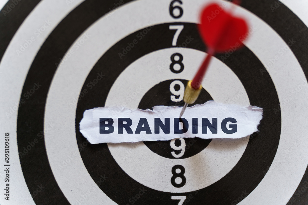 A piece of paper with the text is nailed to the target with a dart - BRANDING A piece of paper with the text is nailed to the target with a dart - BRANDING