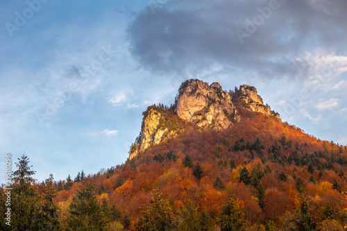 Autumn rural landscape with mountain peak on background. The Vratna valley in Mala Fatra national park, Slovakia, Europe.