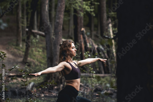 Girl go in for sports in the forest. Exercises  gymnastics  relaxation. 