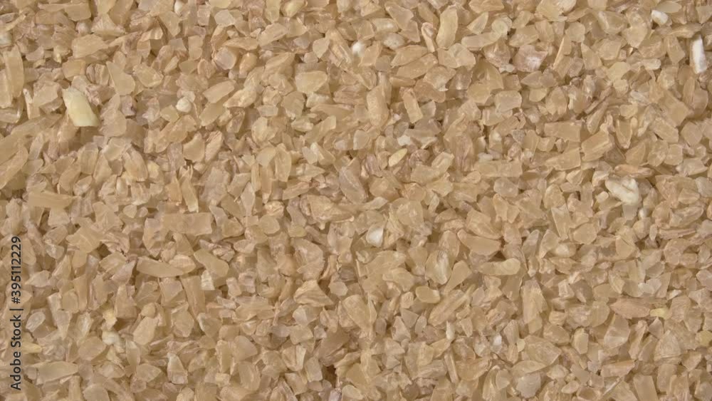 Rotation of wheat grit close-up. Solid wheat varieties. Wheat porridge. Rotation of wheat grit close-up. Solid wheat varieties. Wheat porridge.