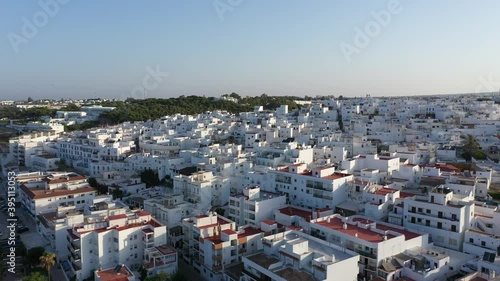 Aerial views of a white andalusian town at the beach, Conild er la Frontera from a drone perspective