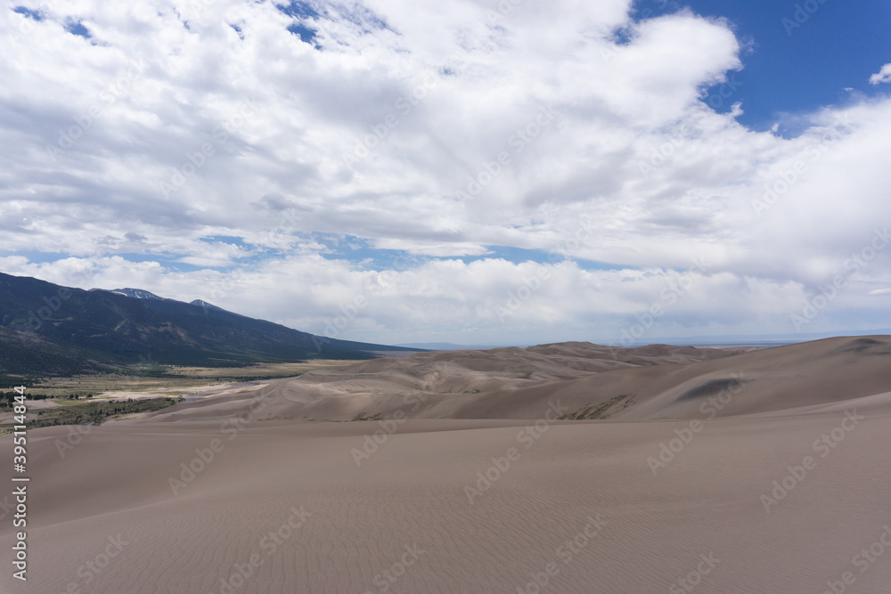 Mountains behind sand dunes in Colorado