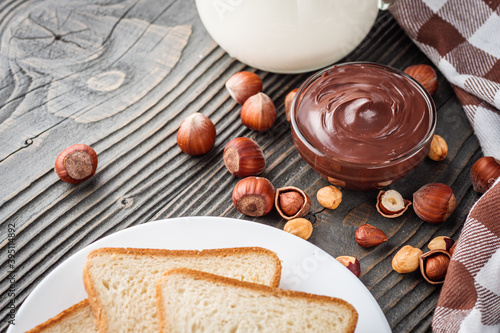 toasts with chocolate butter on a dark wooden rustic background