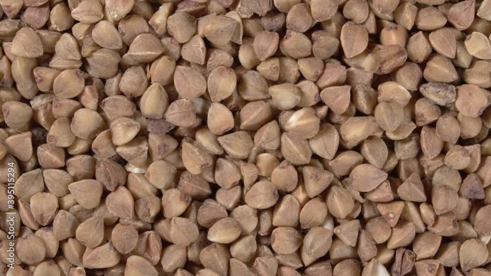Rotation of buckwheat close-up. Buckwheat porridge. Raw buckwheat. Rotation of buckwheat close-up. Buckwheat porridge. Raw buckwheat.
