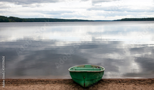 Cloudy quiet day on the shore of North lake in summer. photo