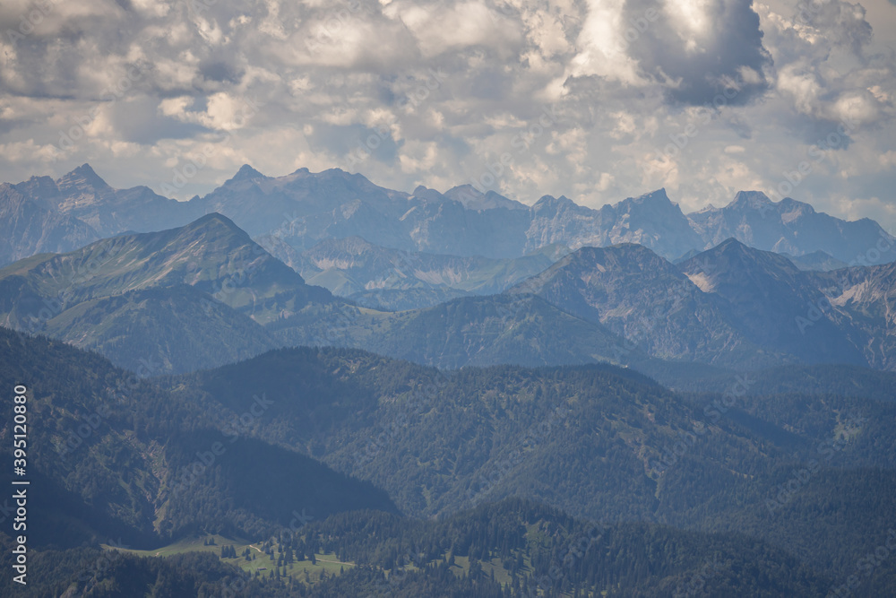 pre alps in bavaria with montain silhouettes and clouds pre alps in bavaria with montain silhouettes and clouds