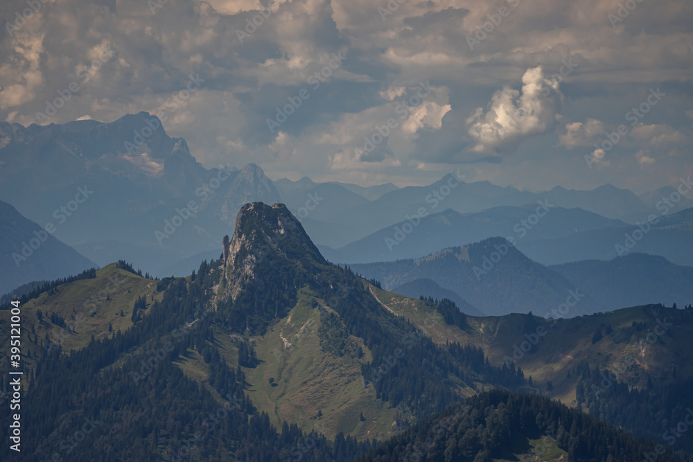 Obraz premium pre alps in bavaria with montain silhouettes and clouds