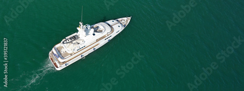 Aerial drone top down ultra wide panoramic photo of luxury yacht anchored in Mediterranean port © aerial-drone