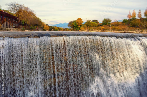 Autumn landscape with river and waterfall. Cijevna river waterfall.  Montenegro, Podgorica photo